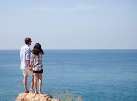 Young couple enjoy beautiful sea view on vacation