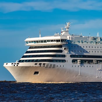 White cruise liner sailing on a clear day