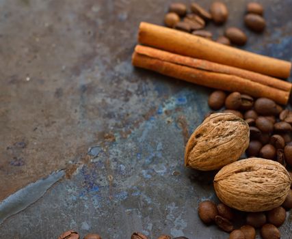 coffee beans nuts cinnamon stick on grunge background