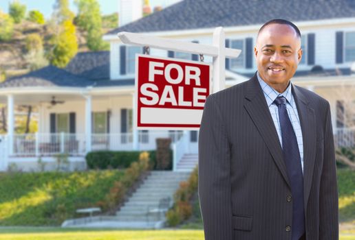 African American AgentIn Front of Beautiful Custom House and For Sale Real Estate Sign.