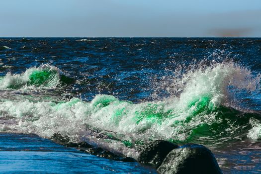 Summer ocean beach with green waves at sunny day