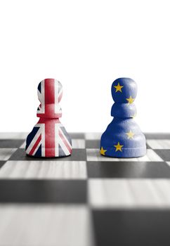 Two chess pawns with UK and European flags 