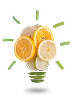Light bulb made of fruits and vegetables over a white background