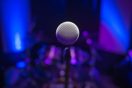 Microphone on stage against a background of auditorium, France