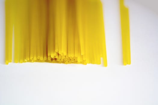 raw spaghetti pasta on a white background. Macro shot