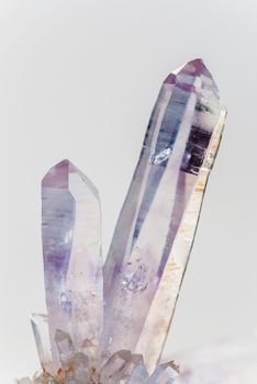 Two crystals of natural purple transparent gemstone amethyst