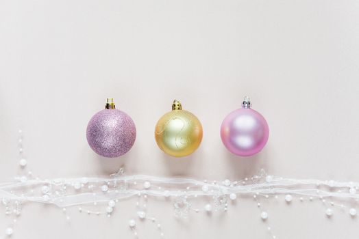 Beautiful Christmas composition with Christmas balls on a pink background. Flat lay composition for greeting cards, websites, social media, magazines, bloggers, artists etc. Christmas wallpaper