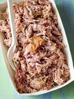 close up of rustic american pulled pork in paper tray