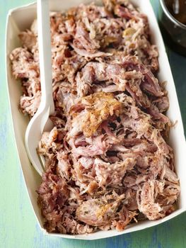 close up of rustic american pulled pork in paper tray