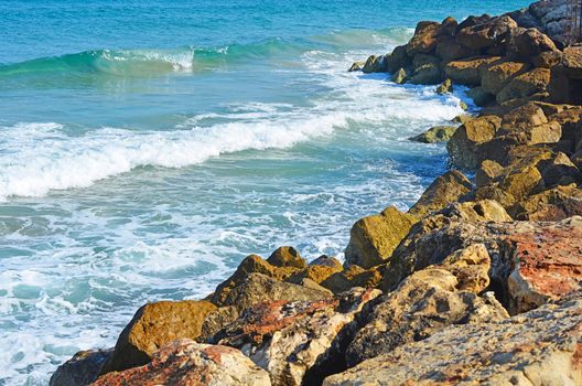 Sea waves break about stones northern Israel