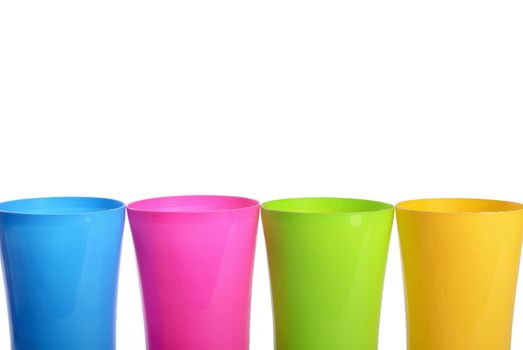 Plastic colorful cups isolated on white background