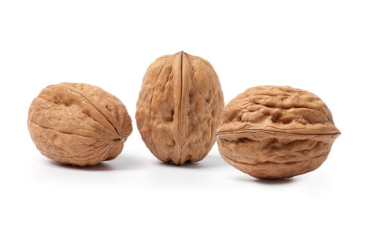 Walnuts close up, isolated on a white background.
