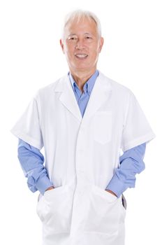 Portrait of old Asian man in lab uniform smiling, standing isolated on white background.