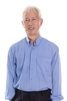Portrait of old Asian man smiling, standing isolated on white background.