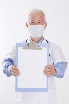 Portrait of Asian medical doctor in face mask showing health report, standing isolated on white background.