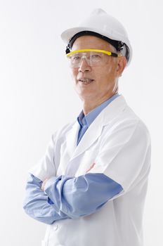 Portrait of Asian senior engineer with hard helmet and uniform, standing isolated on white background.