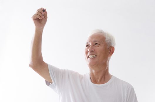 Portrait of old Asian man hand writing on blank space, isolated on white background.