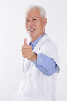 Portrait of confident Asian lab people smiling and giving thumbs up, standing isolated on white background.