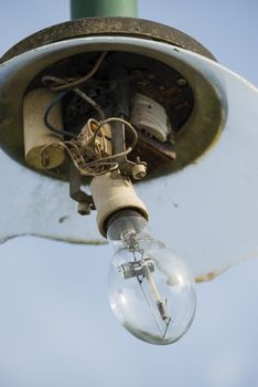 Broken glass diffuser of a street lamp post.