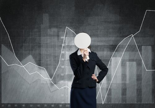 Businesswoman and graphs at background hiding her face behind mask