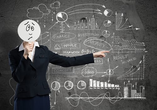 Businesswoman and graphs at background hiding her face behind mask