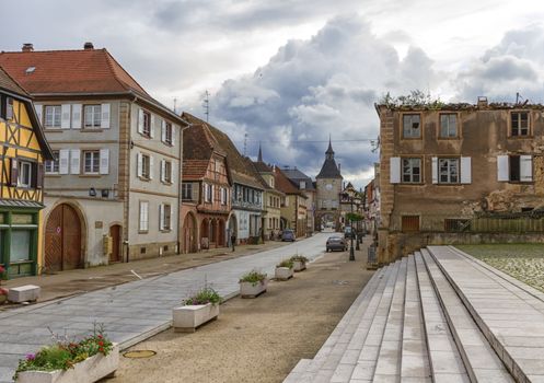 Street and historic gate in Rosheim, Alsace, France