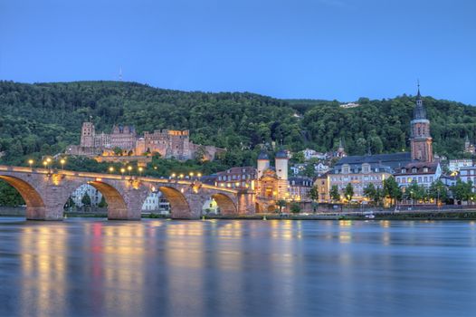Old castle, Carl-Theodor bridge and Neckar river by night, Heidelberg, Germany, HDR