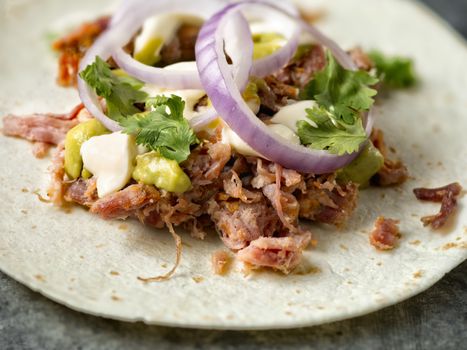 close up of rustic mexican american pulled pork tacos