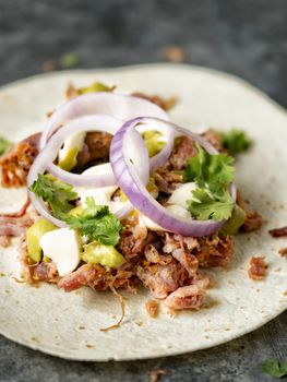 close up of rustic mexican american pulled pork tacos