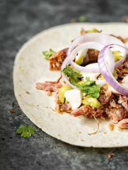 close up of rustic mexican american pulled pork tacos