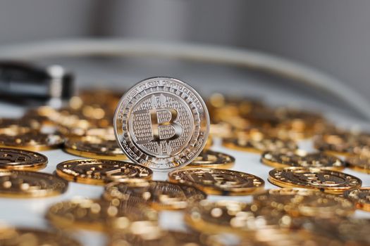 Cryptocurrency physical metal bitcoin coin. Digital currency virtual money concept.