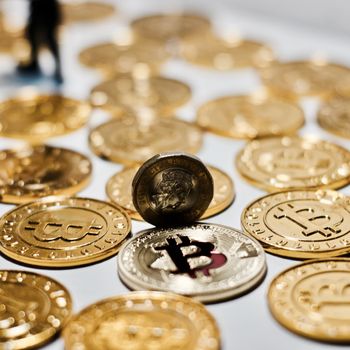 Cryptocurrency physical metal bitcoin coin. Digital currency virtual money concept.