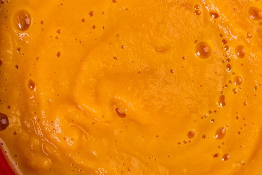 Texture of pumpkin soup close-up. Autumn dish