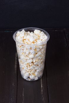 Popcorn in box on the black background