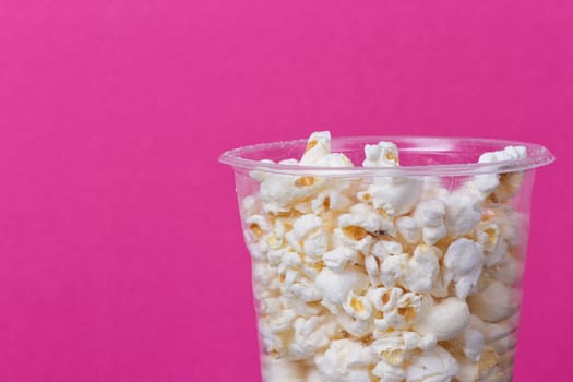 Popcorn In Bucket on the Pink Background.