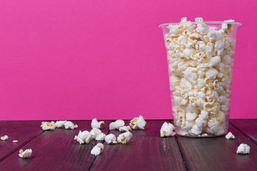 Popcorn In Bucket on the Pink Background.