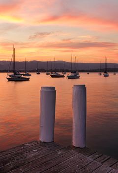 Boat moorings at sunset from the timber jetty.
