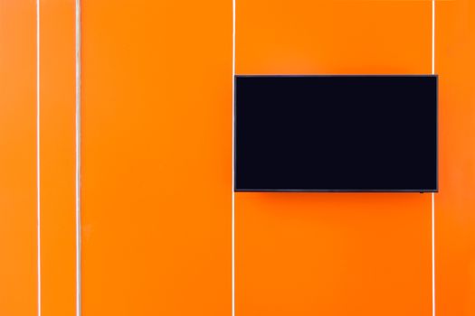 home interior decoration, lcd tv against orange wall