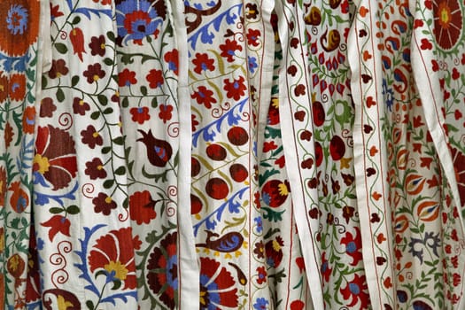 Traditional uzbek suzani embroidery fabrics at oriental bazaar, Bukhara, Uzbekistan