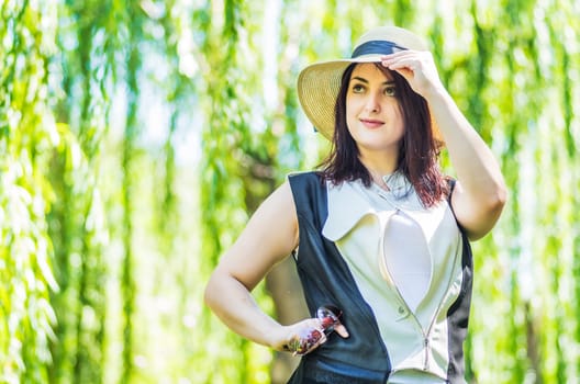 young caucasian business woman in stylish clothes in the park