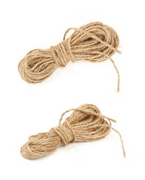 Two different angles of small coil skein of natural brown twine hessian burlap jute rope isolated on white background, close up, high angle view