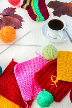 Autumn knitting with a mug of coffee on a white background