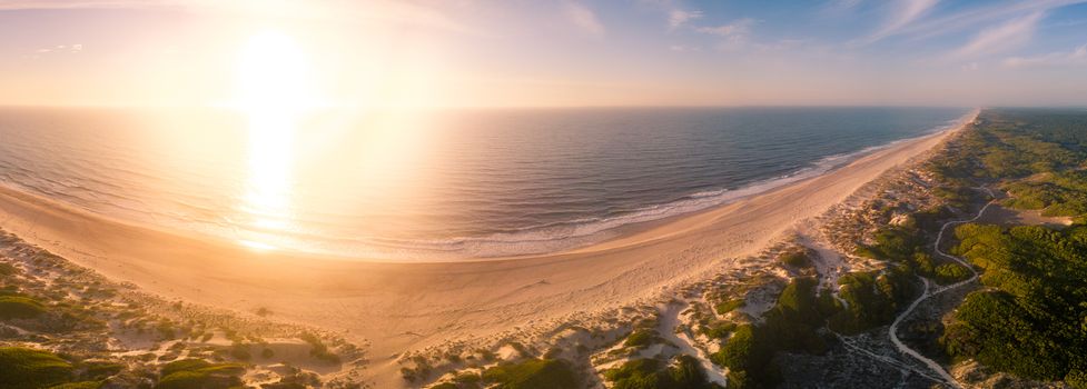 Aerial view of beach and sand dunes at sunset in Murtosa, Aveiro - Portugal. North view.