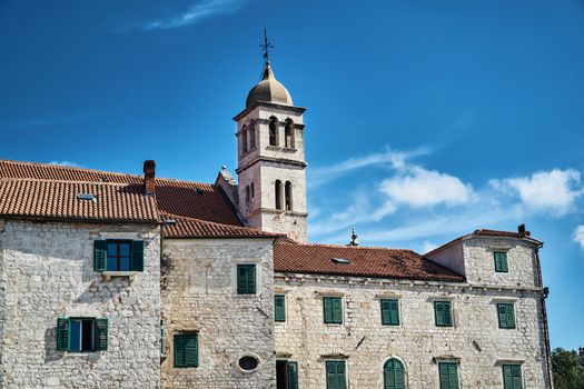 stone houses and church bell tower in the city of Sibenik in Croatia