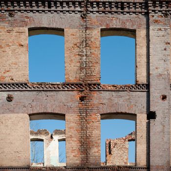 discarded ruin with old windows and wall, industrial window in concrete wall
