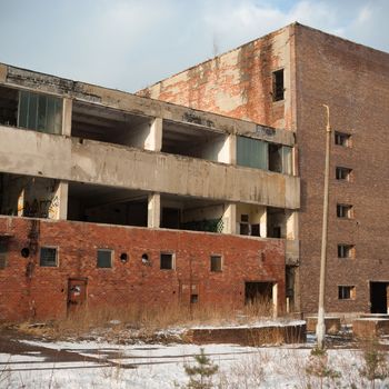 discarded ruin with old windows and wall, industrial window in concrete wall