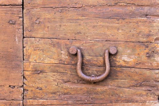 Close up of rustic old door in Spoleto, Italy.