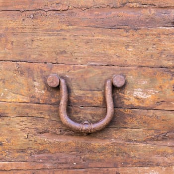 Close up of rustic old door in Spoleto, Italy.