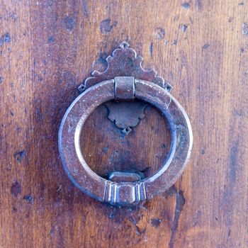 Close up of rustic old door in Spoleto, Italy.