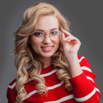 Beautiful girl wearing glasses looking at camera